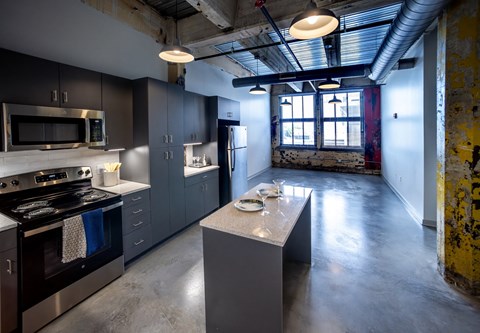 a kitchen with a large island and stainless steel appliances at Conwood Flats, Memphis, Tennessee